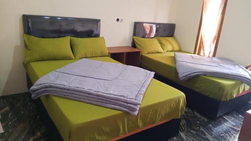 Postel nebo postele na pokoji v ubytování Homestay Safira Bromo