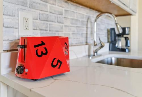 a red box sitting on top of a kitchen counter at Chic 2BR Apartment Near Branch Brook Park in Newark