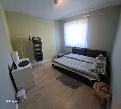 En eller flere senge i et værelse på Agroturystyka nad stawem