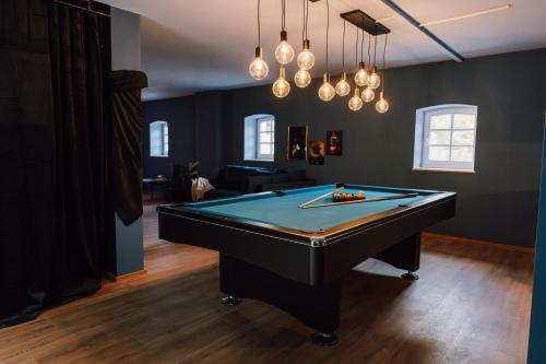 a billiard room with a pool table in it at Zur alten Oelmuehle Wellness & Entertainment in Ahrhütte