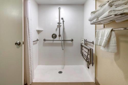 a bathroom with a shower with a shower curtain at Comfort Suites Bethlehem Near Lehigh University and LVI Airport in Bethlehem