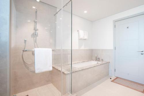 a bathroom with a shower and a sink at Luxurious 3 BR with Burj Khalifa View in Downtown in Dubai