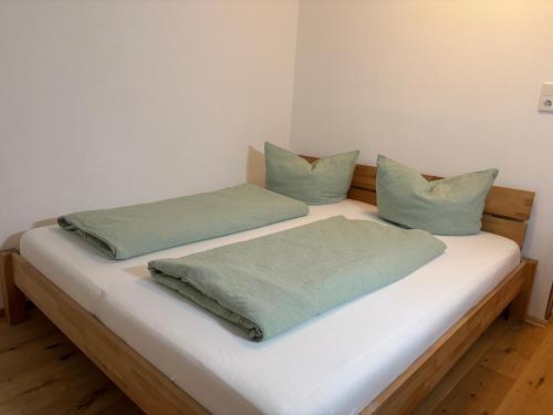 Ένα ή περισσότερα κρεβάτια σε δωμάτιο στο Ferienwohnung Vögel