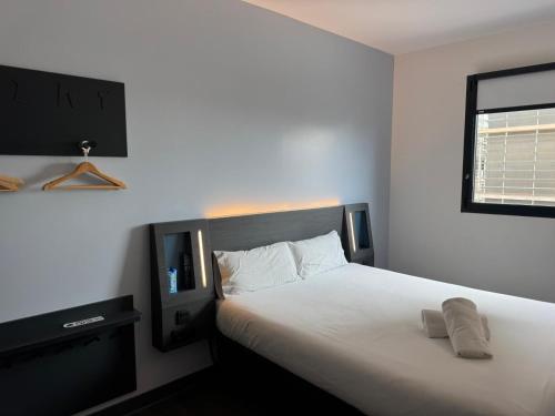 Postel nebo postele na pokoji v ubytování Flex Malaga City Center