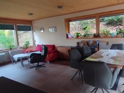 a living room with a table and chairs at Nichtraucherferienwohnung-Neckarblick ZE-2022-74-WZ-118A in Heidelberg