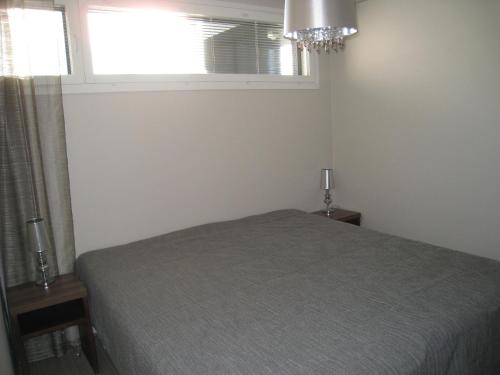 Postel nebo postele na pokoji v ubytování Timantti B15