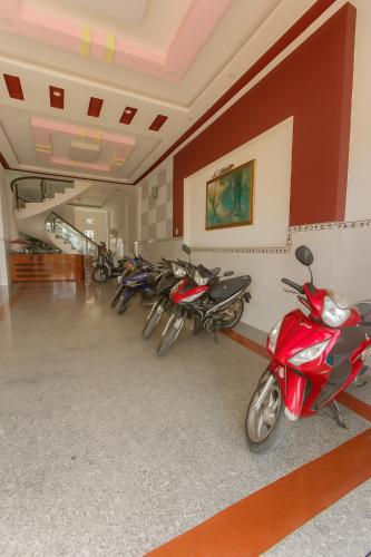 a row of motorcycles parked in a room at Phương Vy Motel in Phước Bình