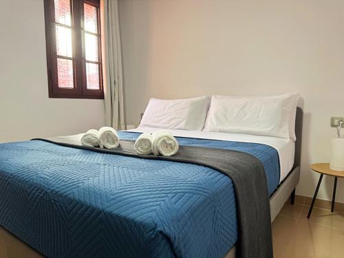 En eller flere senge i et værelse på Atlantico Apartment