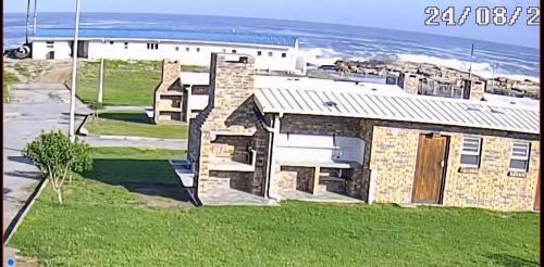 a brick house with a view of the ocean at Malkop Sea View Resort in Lambertʼs Bay