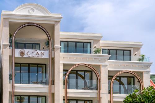 a large building with two arched windows at The Cyan at Patong Hotel in Patong Beach