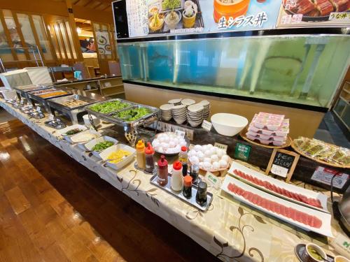 a buffet line with many different types of food at Comfort Inn Kagoshima Taniyama in Kagoshima