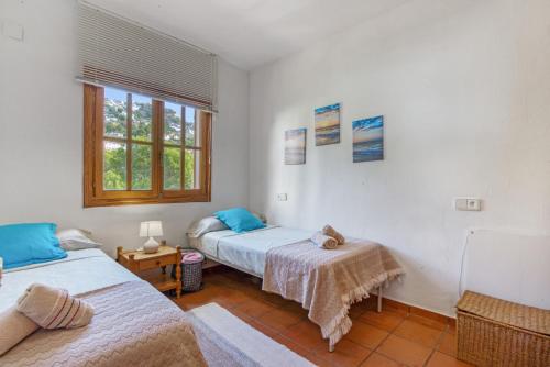 Ένα ή περισσότερα κρεβάτια σε δωμάτιο στο Oceanview House Altea Hills