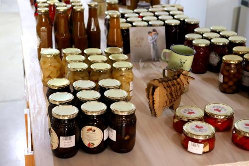 a table full of jars of jam and jars of honey at Grünau Chalets in Khomas Region