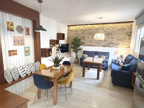 a living room with a couch and a table at XXIX Casa El Balcón in Cortes de la Frontera