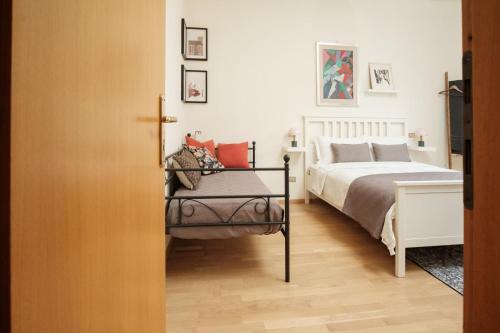 Giường trong phòng chung tại Tra le case di Reggio - Pisacane