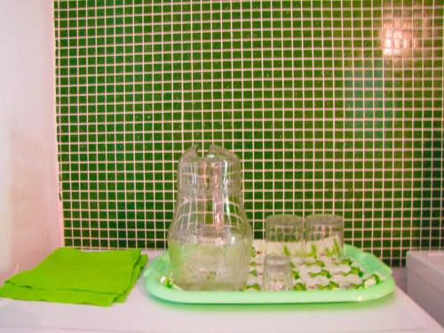 a table with glasses and a plate of food at Room Galina in Duga Resa