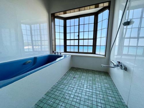 Ένα μπάνιο στο ゲストハウスイコット種子島