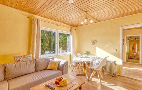 a living room with a couch and a table at Ferienhaus Boitzenburger Land in Rosenow