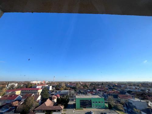 an overhead view of a city with a blue sky at Apartmán Dona in Veľký Meder
