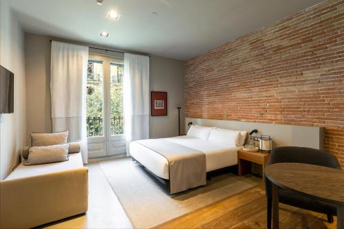 Ένα ή περισσότερα κρεβάτια σε δωμάτιο στο Colectia Stays Pau Claris