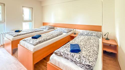 Postel nebo postele na pokoji v ubytování Penzion a ubytovna Oáza