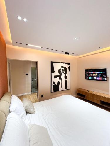 Ένα ή περισσότερα κρεβάτια σε δωμάτιο στο Citi Residence