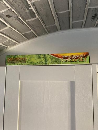 a sign on the top of a refrigerator at Five Cottages in AONB and an Obbit House! in Canterbury