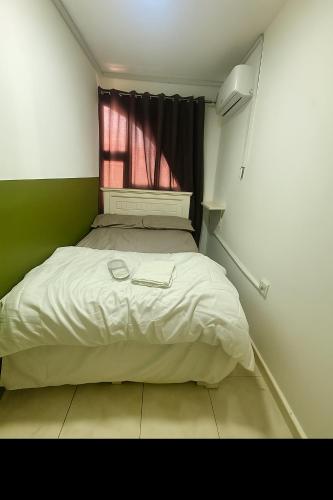 Postel nebo postele na pokoji v ubytování Downtown Private room