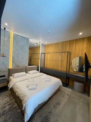 En eller flere senge i et værelse på Osocor Village