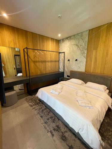 Giường trong phòng chung tại Osocor Village