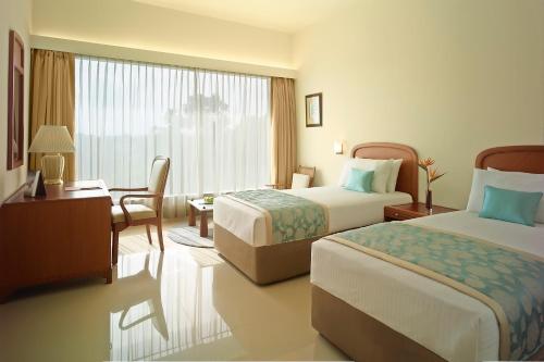 Postel nebo postele na pokoji v ubytování Ginger Gondia, Balaghat Road