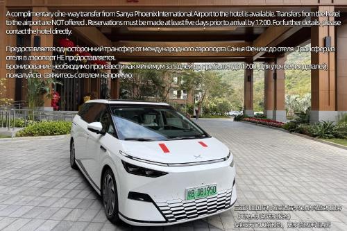 a white car parked in front of a building at Holiday Inn & Suites Sanya Yalong Bay in Sanya