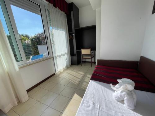 Postel nebo postele na pokoji v ubytování SeaPark SPA Resort