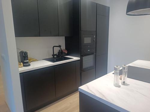 Η κουζίνα ή μικρή κουζίνα στο New and bright apartment