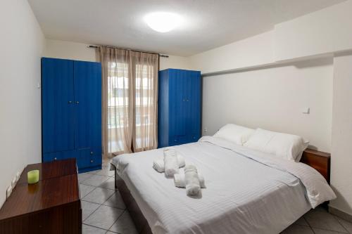 Ένα ή περισσότερα κρεβάτια σε δωμάτιο στο Manolia