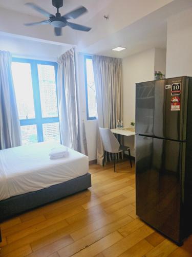 Ένα ή περισσότερα κρεβάτια σε δωμάτιο στο Colony Infinitum KualaLumpur by FR