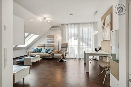 a living room with a couch and a table at ! NEU ! Markgraf Premium Apartments - Bad Bellingen in Bad Bellingen