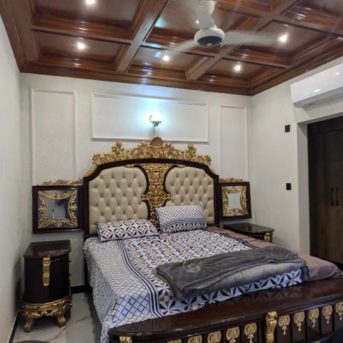 a bedroom with a large bed in a room at AlFalah Guest House in Murree