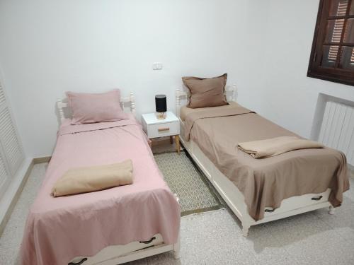 Postel nebo postele na pokoji v ubytování Dalton's villa avec piscine