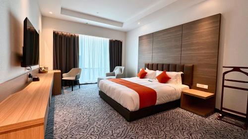 Ένα ή περισσότερα κρεβάτια σε δωμάτιο στο Imperial Hotel