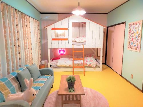a living room with a couch and a bunk bed at Soma City - House - Vacation STAY 15643 in Komagamine