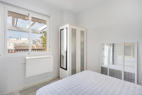 Ένα ή περισσότερα κρεβάτια σε δωμάτιο στο Atico playa de Rota