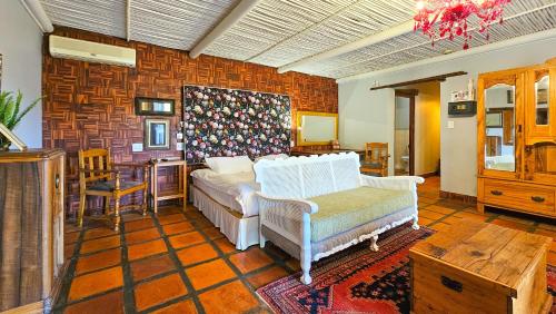 Ένα ή περισσότερα κρεβάτια σε δωμάτιο στο De Opstal Country Lodge