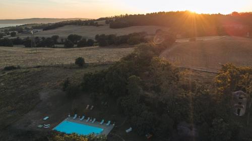 an aerial view of a farm with a pool in a field at Collina Blu - Umbria - Lago di Bolsena in Bolsena