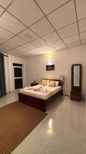a bedroom with a large bed in a room at The Kandy Look Homestay in Kandy