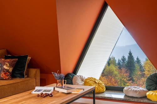 a room with a table and a large window at Willa Bukowy Las - Everslow in Szklarska Poręba