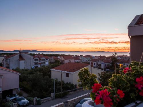 a view of a city with a sunset in the background at Villa Valentina in Zadar