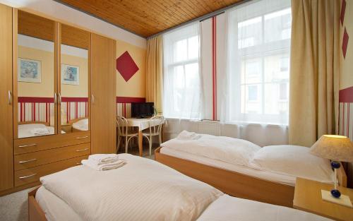 Postel nebo postele na pokoji v ubytování Hotel Neun 3/4