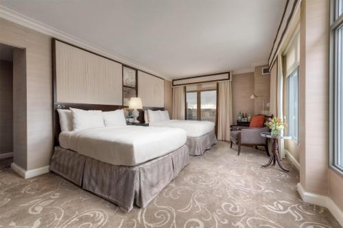 a hotel room with two beds and a desk at Hamilton Hotel - Washington DC in Washington