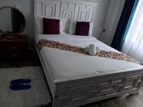 Ένα ή περισσότερα κρεβάτια σε δωμάτιο στο HK Villas